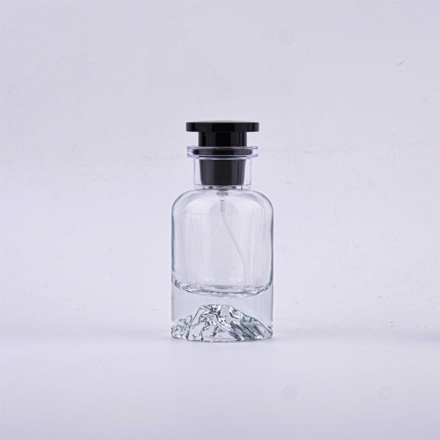 Contemporary Elegance: Crystal-Clear Glass Perfume Bottles with Black Accents