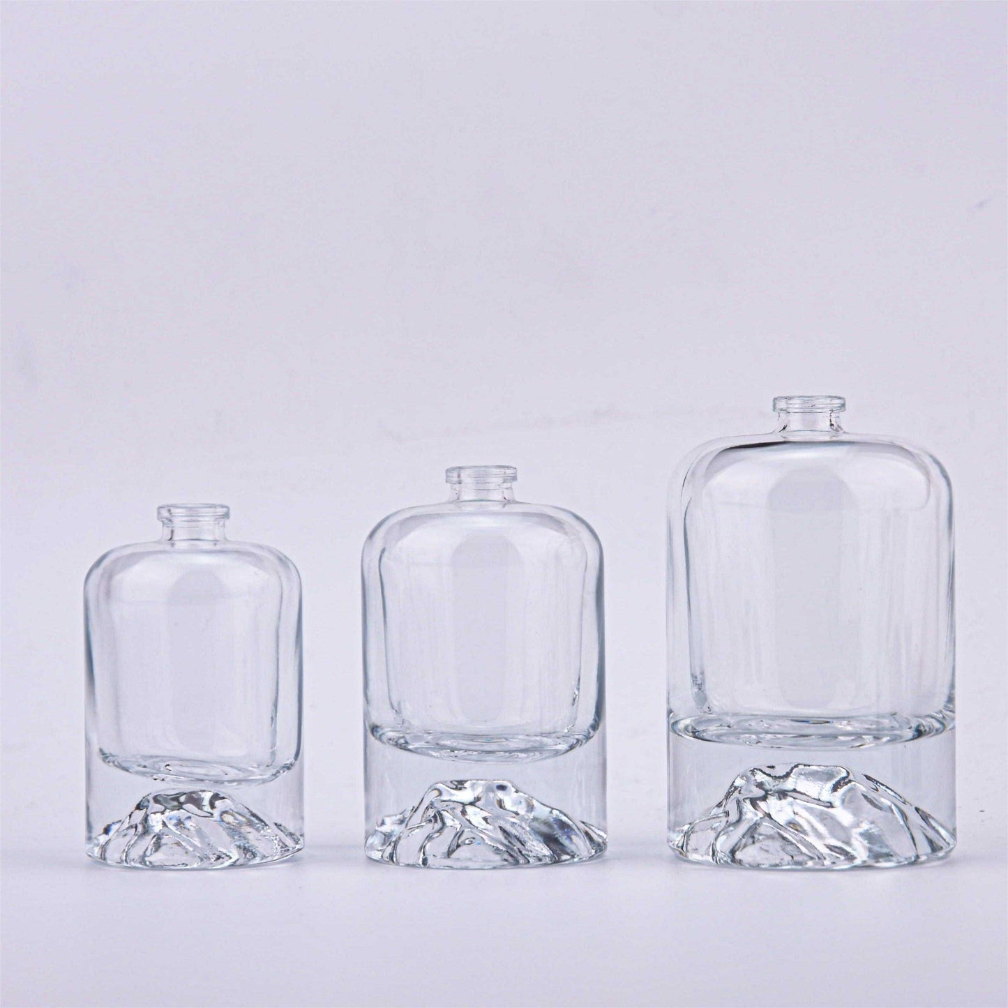 Contemporary Elegance: Crystal-Clear Glass Perfume Bottles with Black Accents